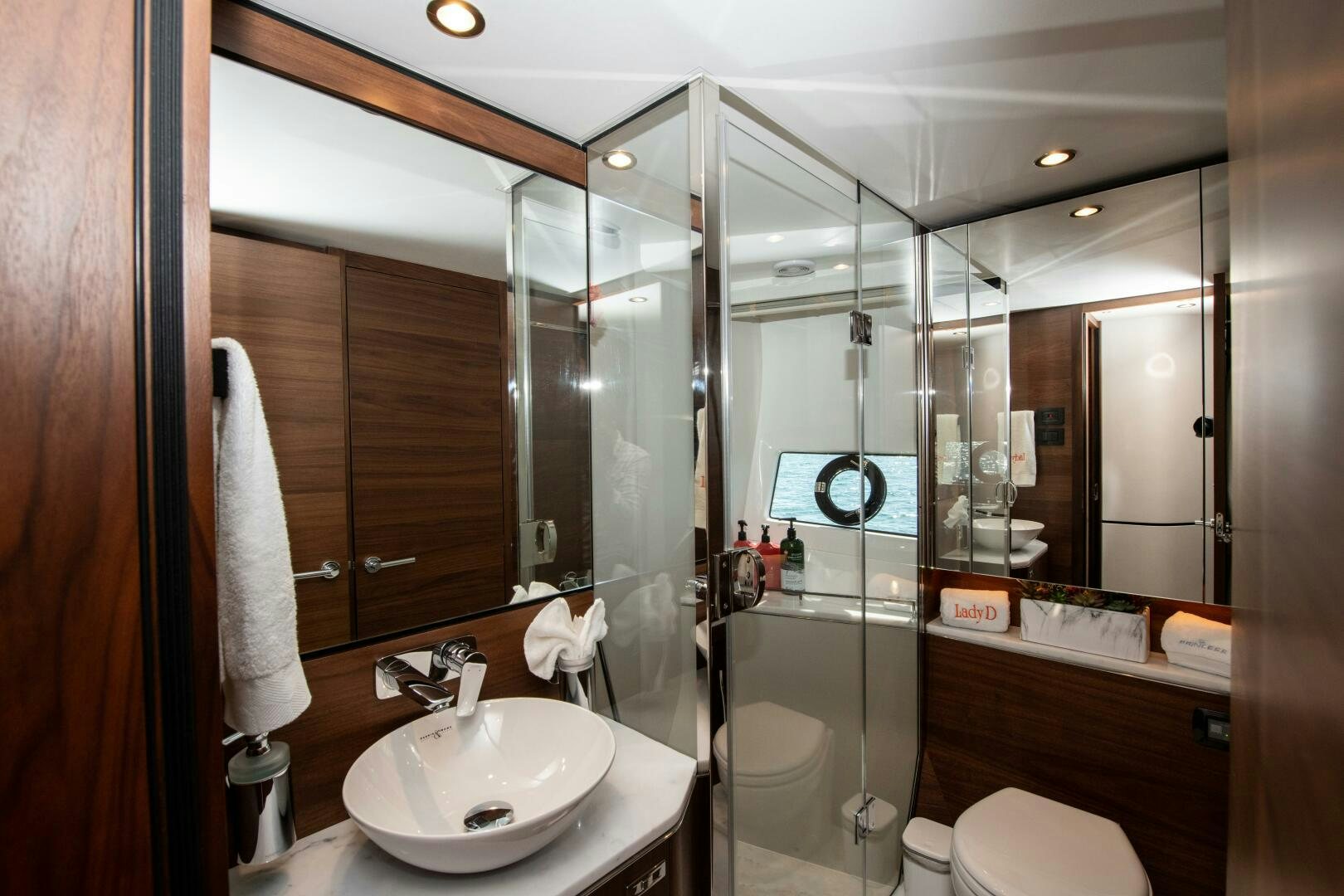 a bathroom with a glass shower aboard LADY D Yacht for Sale