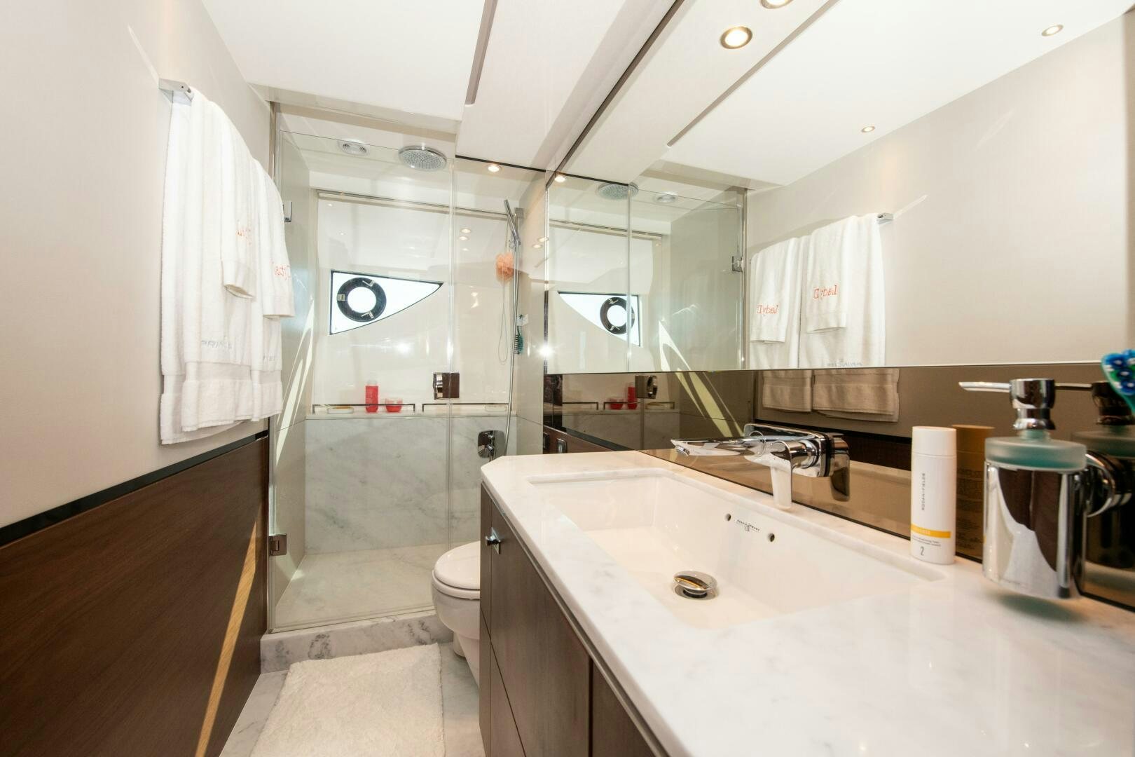 a bathroom with a glass shower aboard LADY D Yacht for Sale