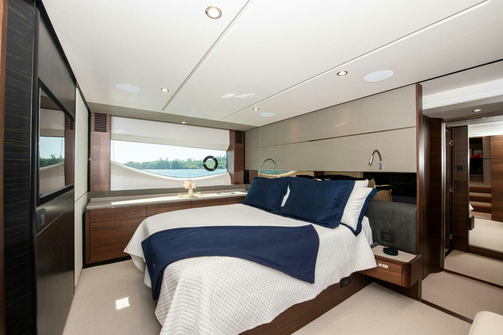 a room with a bed and a window aboard LADY D Yacht for Sale