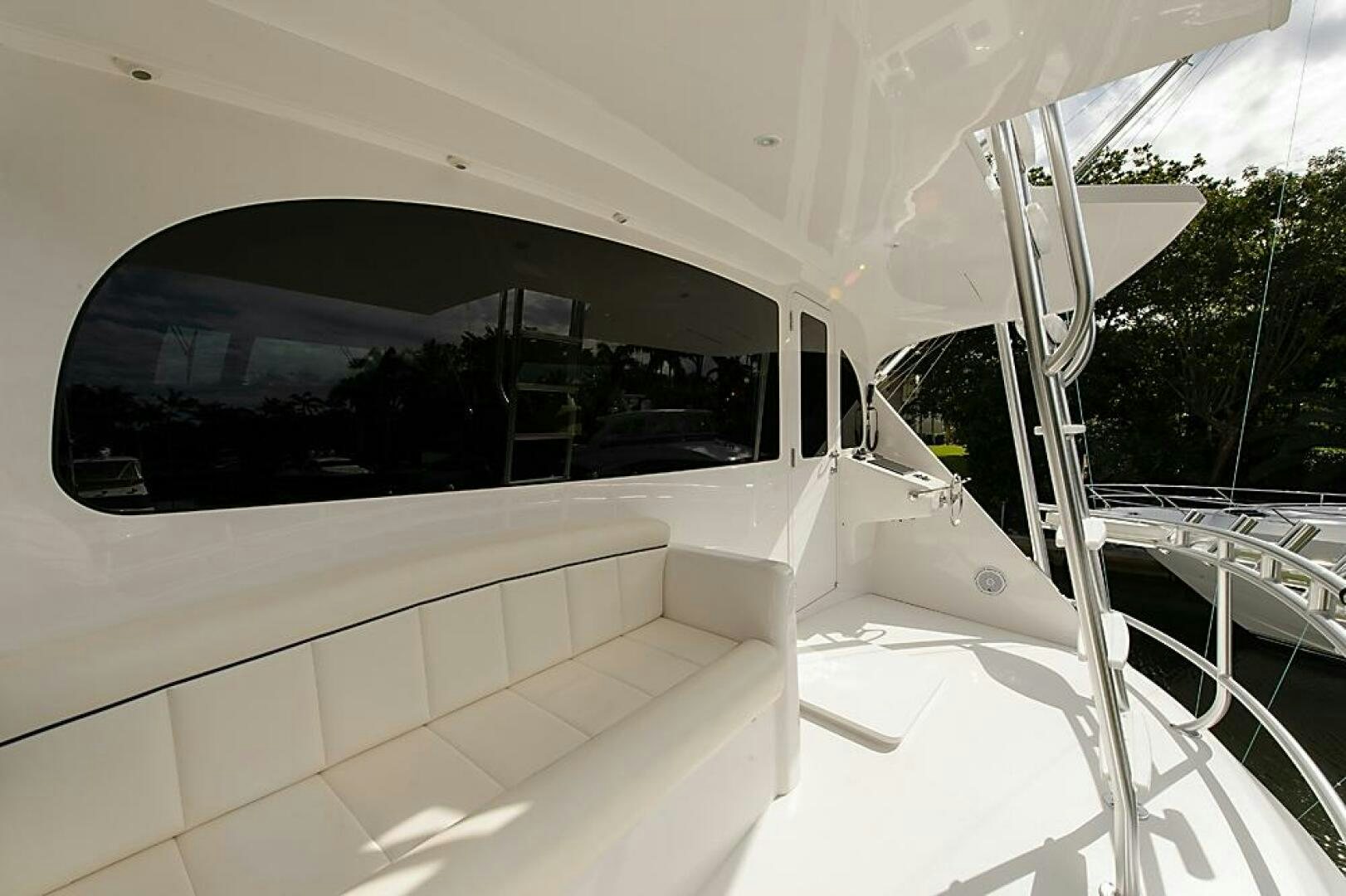 a white car with a large window aboard ASASKA Yacht for Sale