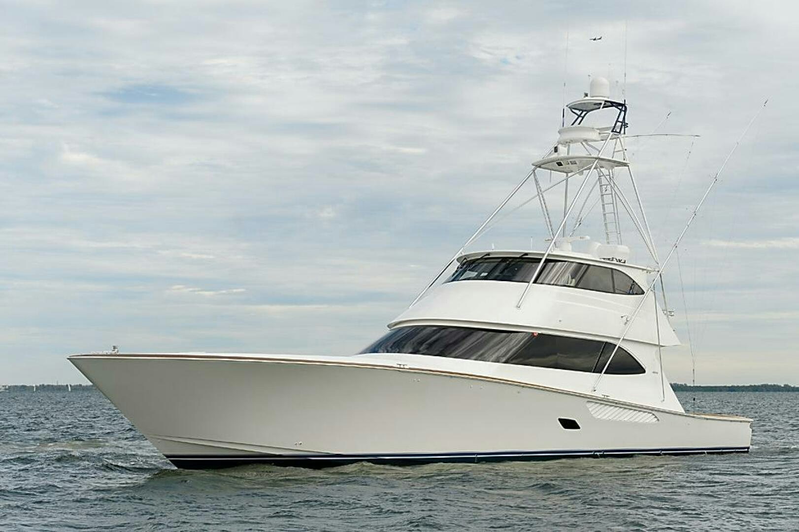 a white yacht in the water aboard ASASKA Yacht for Sale