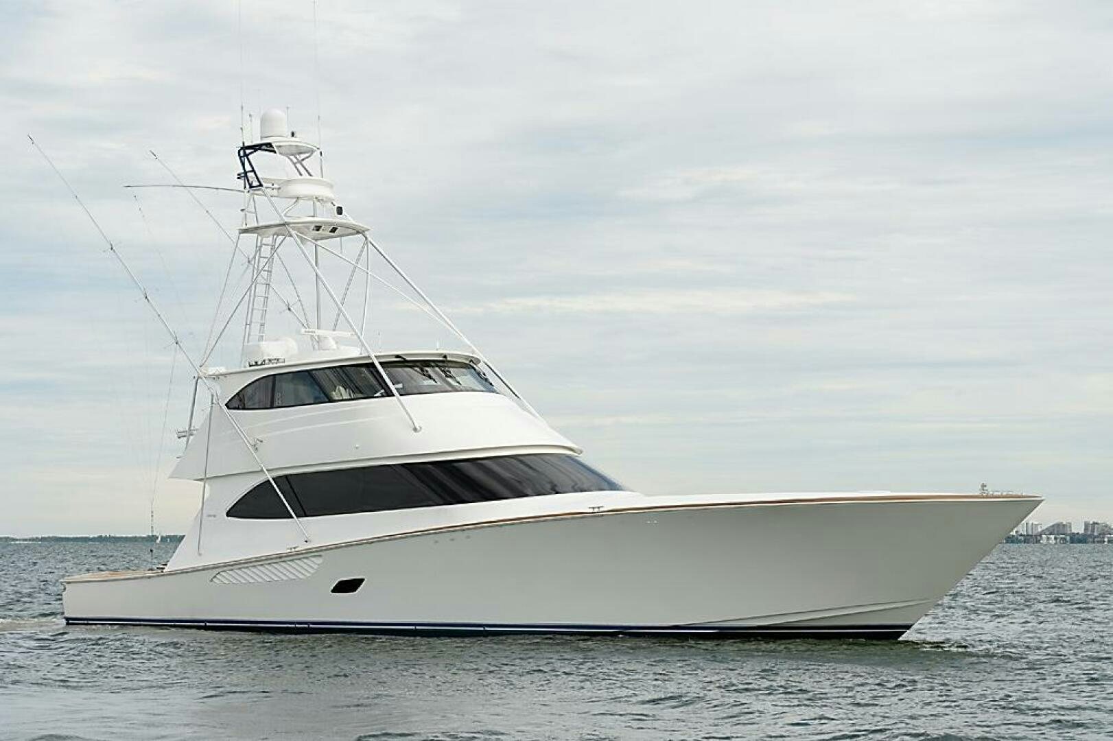 a white yacht in the water aboard ASASKA Yacht for Sale