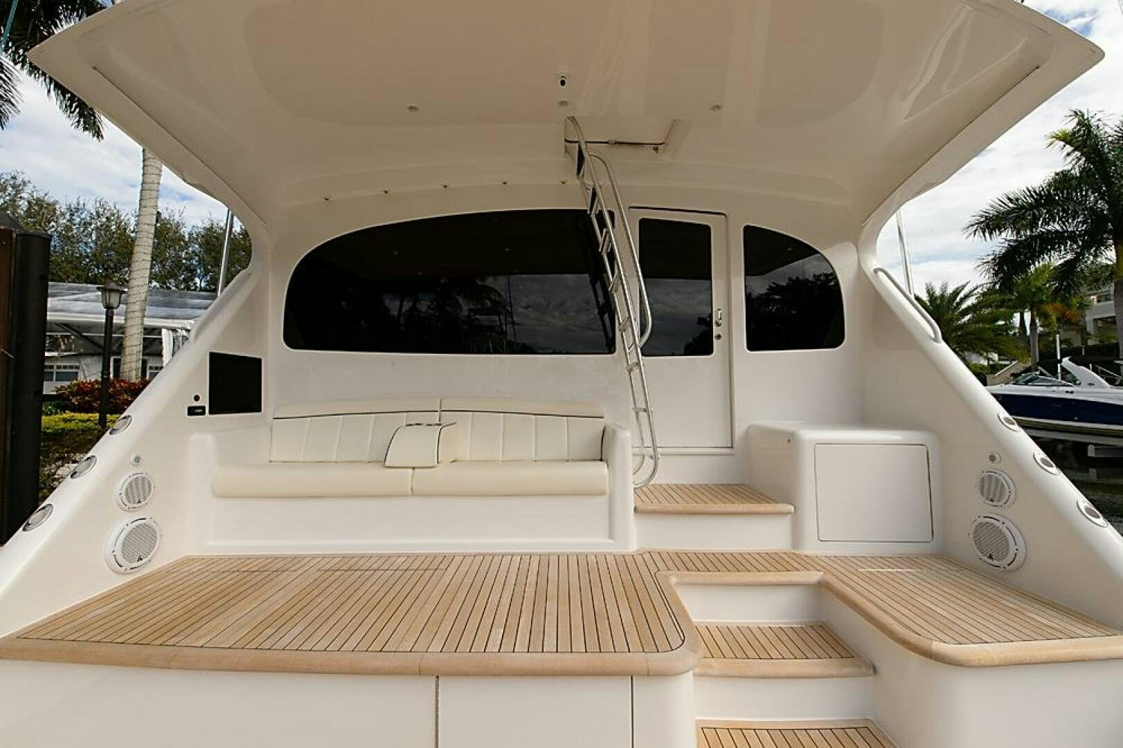 a white boat on a deck aboard ASASKA Yacht for Sale