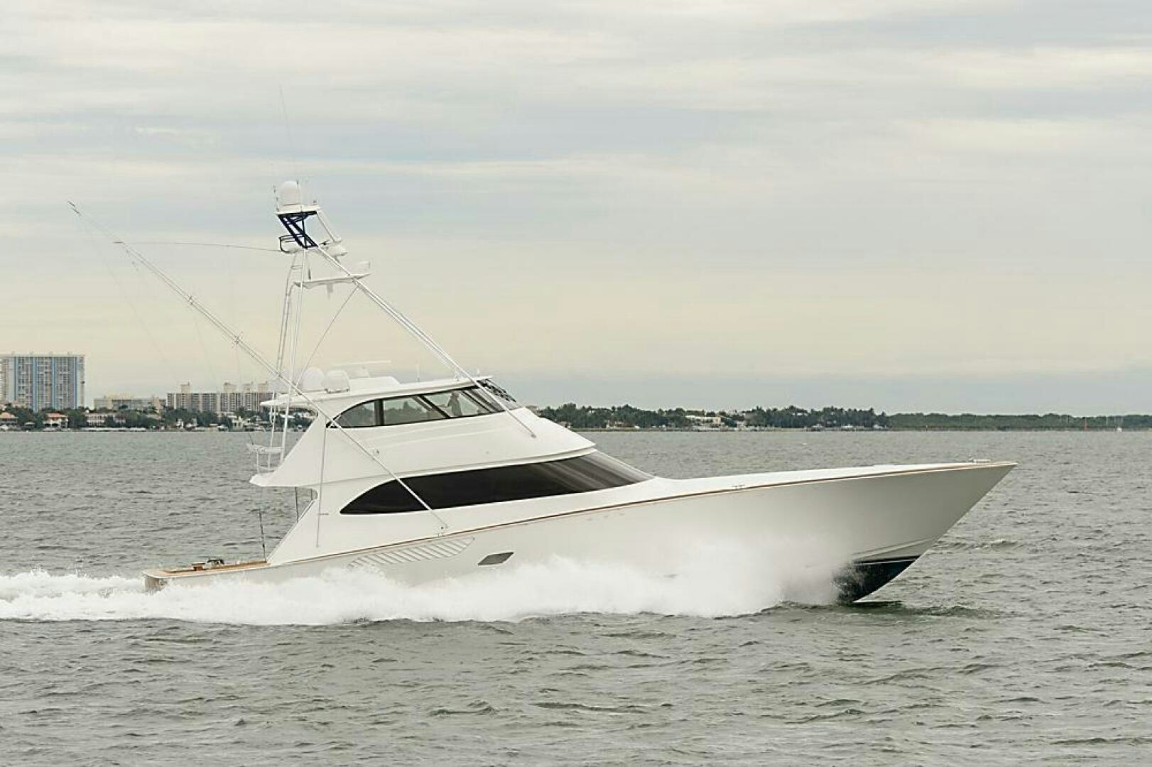a white boat in the water aboard ASASKA Yacht for Sale