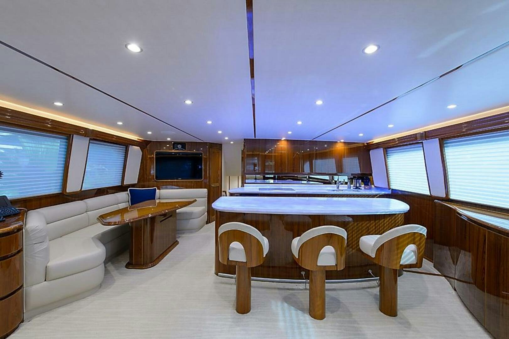 a large room with a table and chairs aboard ASASKA Yacht for Sale