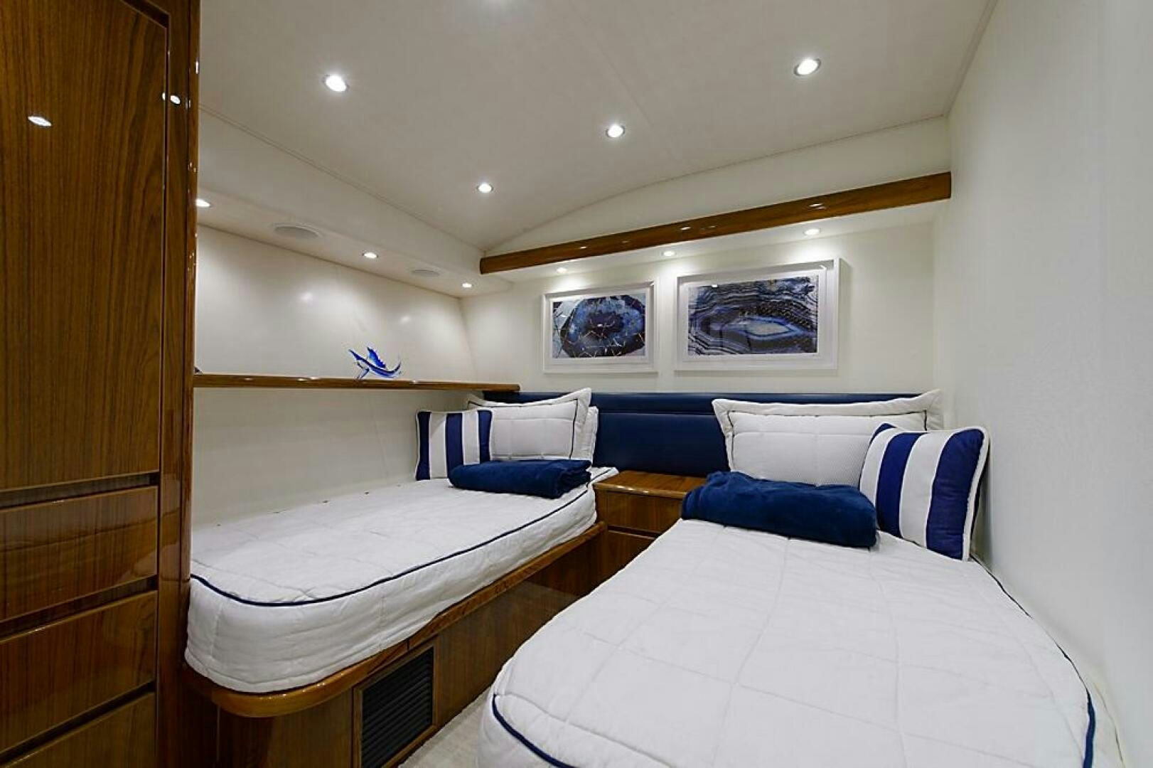 a room with a bed and a desk aboard ASASKA Yacht for Sale