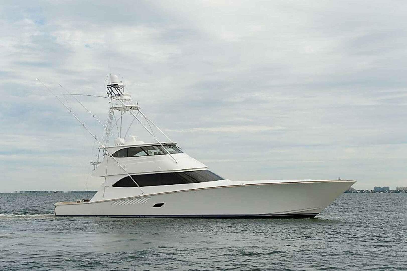 a white yacht on the water aboard ASASKA Yacht for Sale