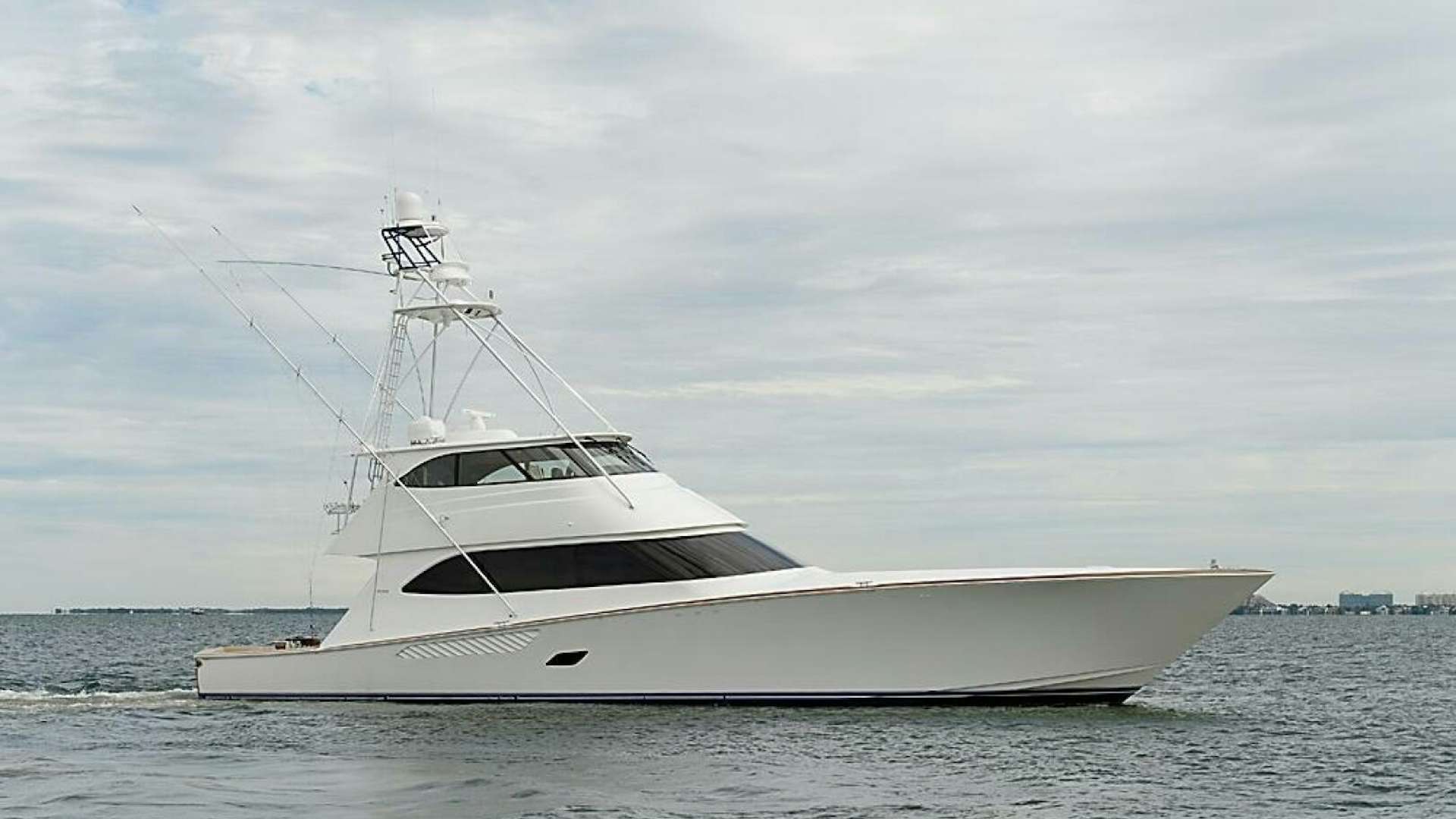 a white yacht on the water aboard ASASKA Yacht for Sale
