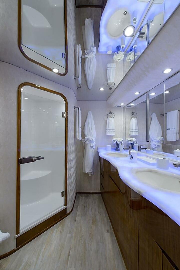 a bathroom with a large mirror aboard ASASKA Yacht for Sale