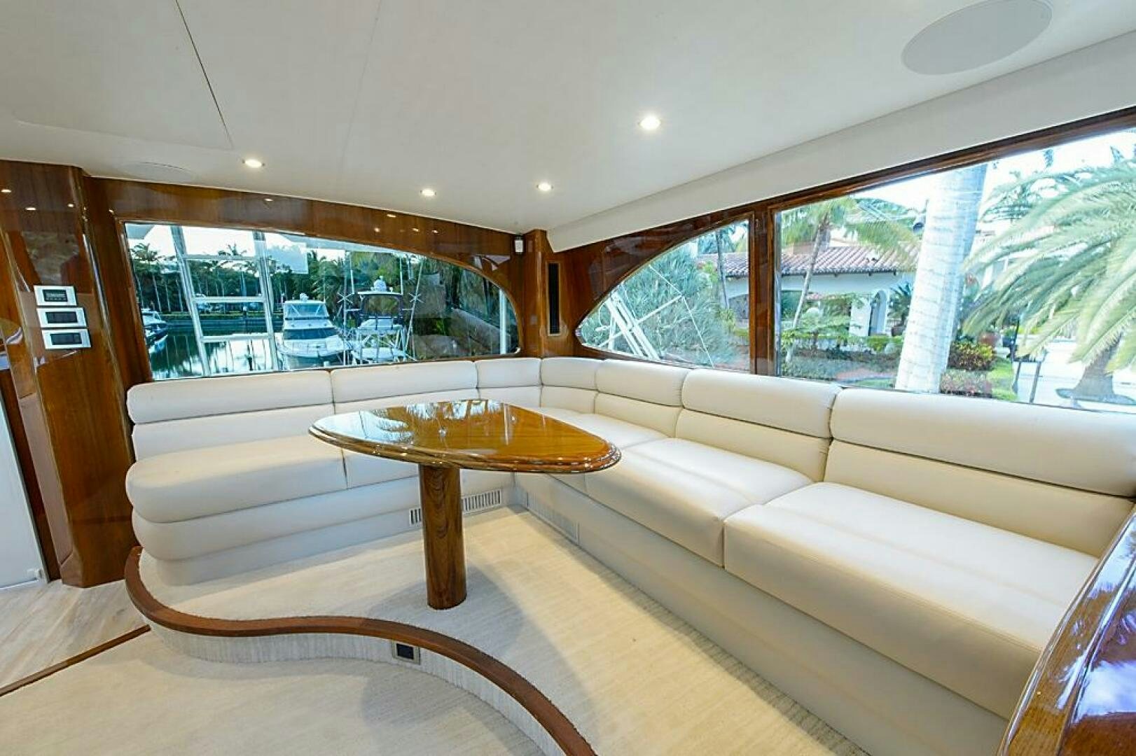 a living room with a couch and a table aboard ASASKA Yacht for Sale