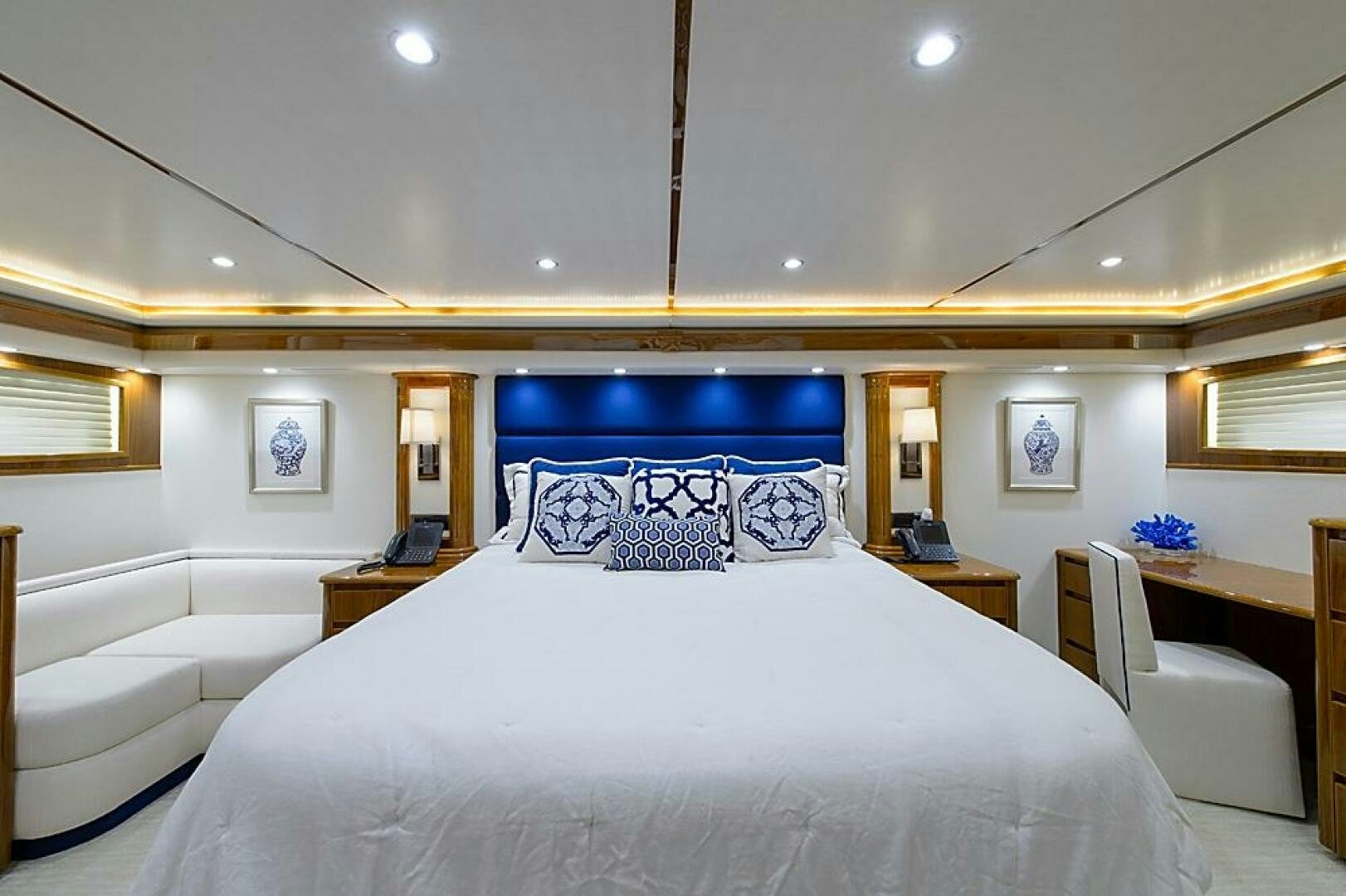 a large bedroom with a large bed aboard ASASKA Yacht for Sale