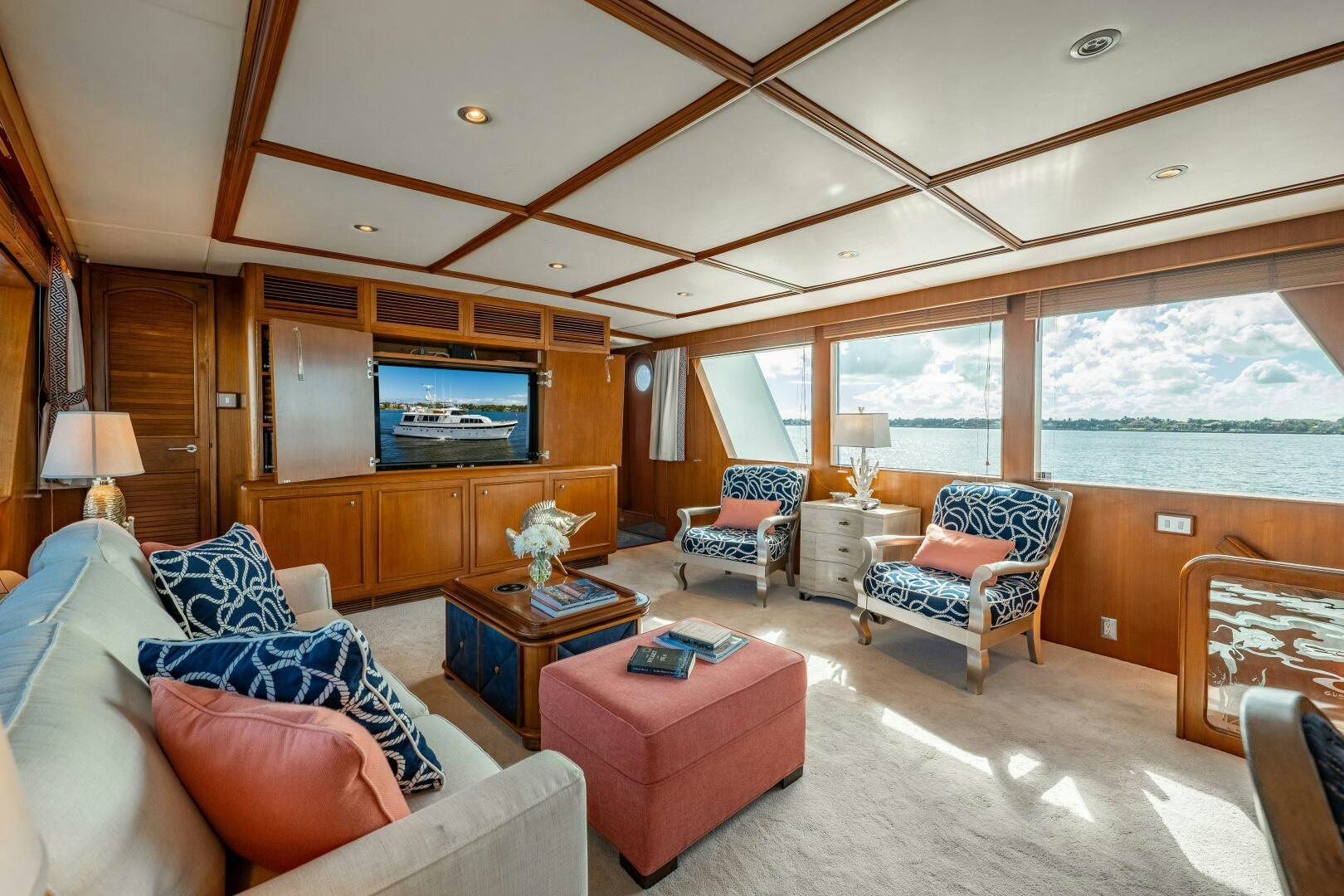a living room with a large window aboard TRILOGY Yacht for Sale