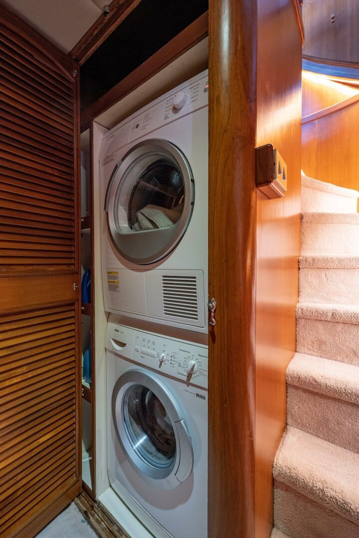 a washing machine in a room aboard TRILOGY Yacht for Sale