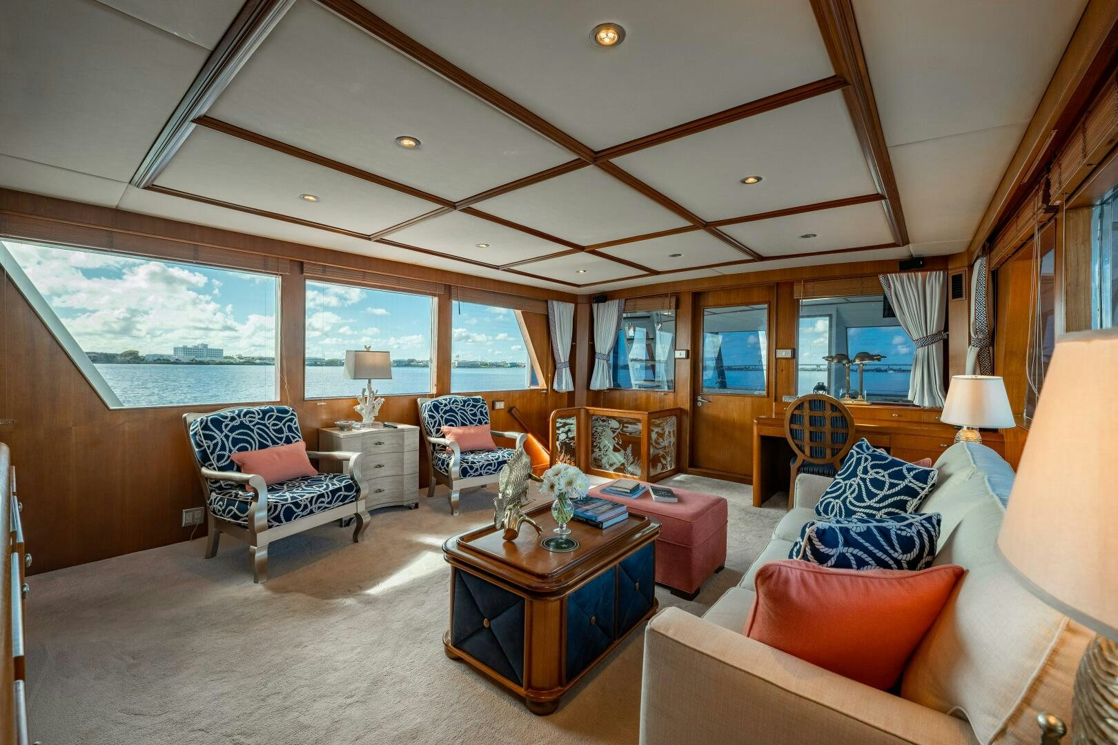 a large living room with a large window aboard TRILOGY Yacht for Sale