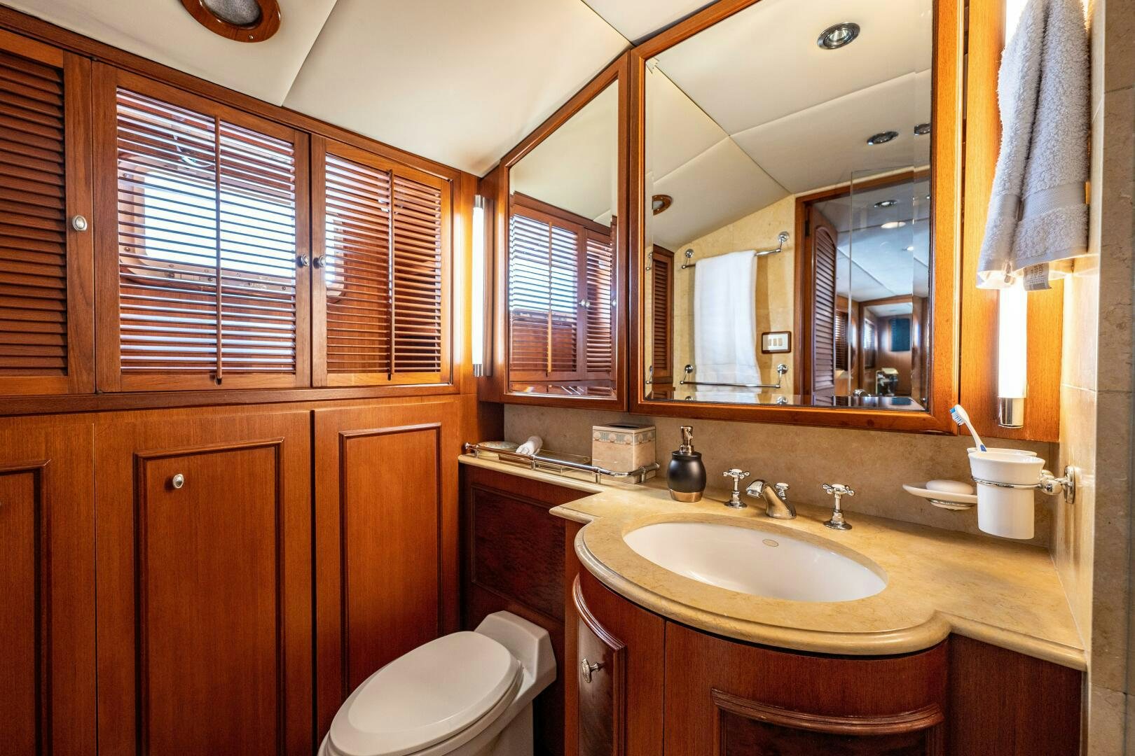 a bathroom with a large mirror aboard TRILOGY Yacht for Sale