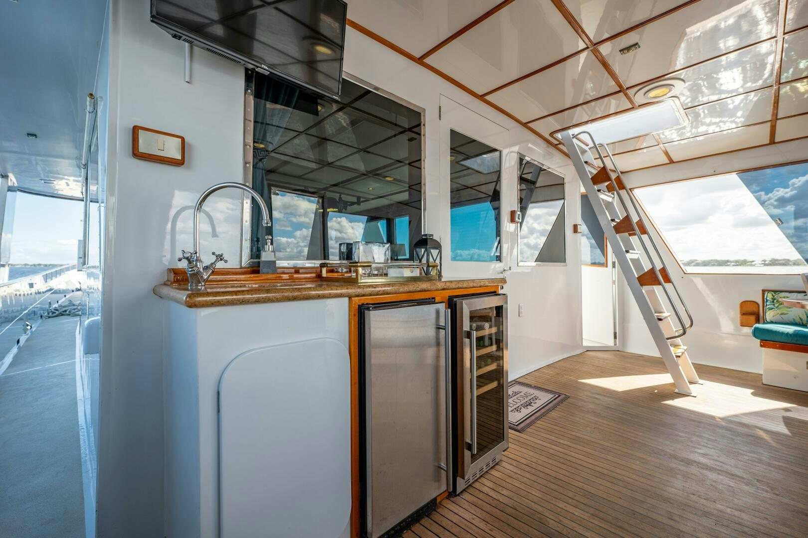 a kitchen with a large window aboard TRILOGY Yacht for Sale