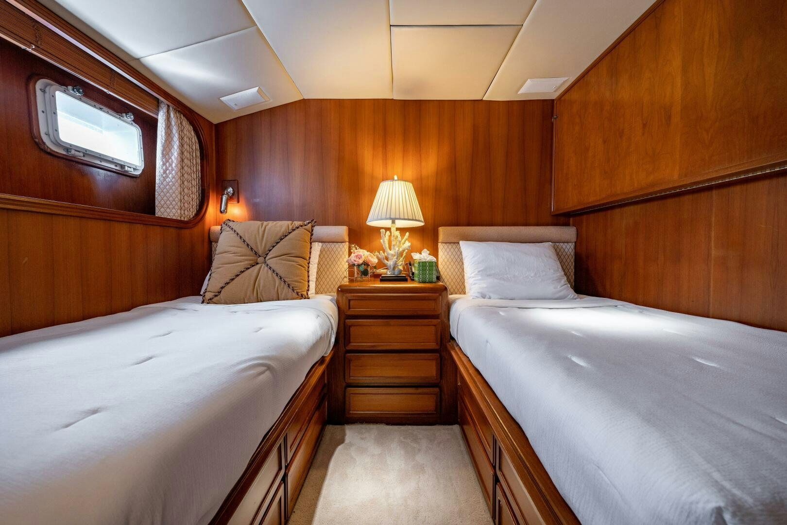 a room with two beds aboard TRILOGY Yacht for Sale