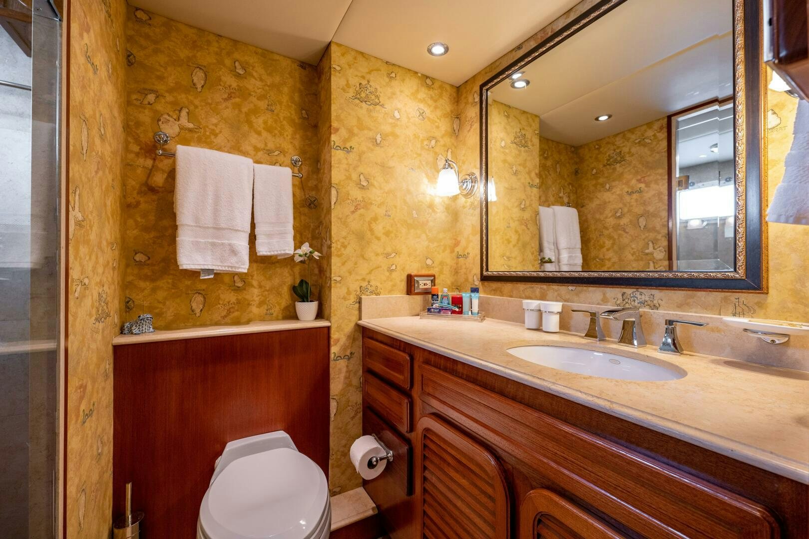 a bathroom with a large mirror aboard TRILOGY Yacht for Sale