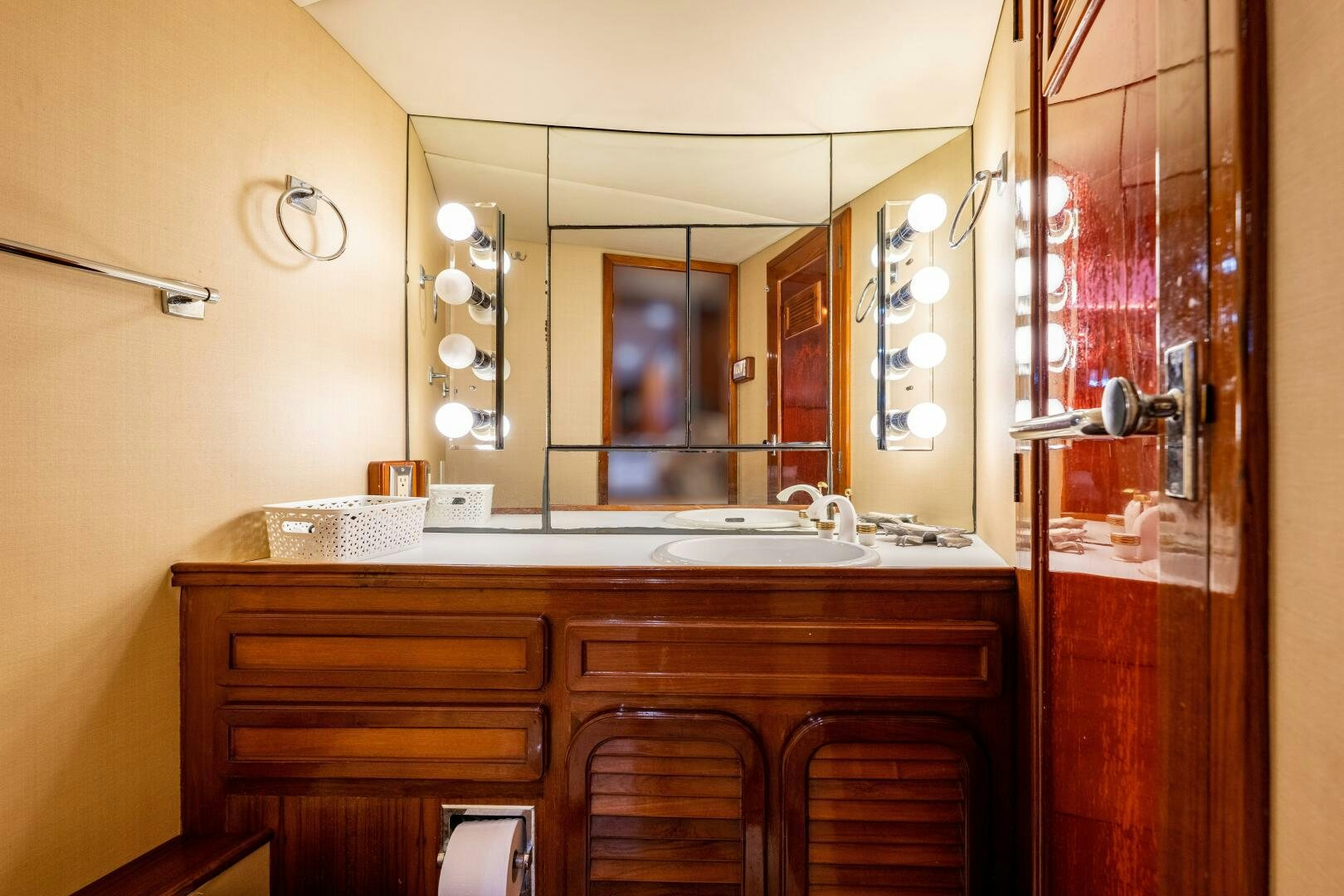a bathroom with a sink and cabinets aboard TRILOGY Yacht for Sale