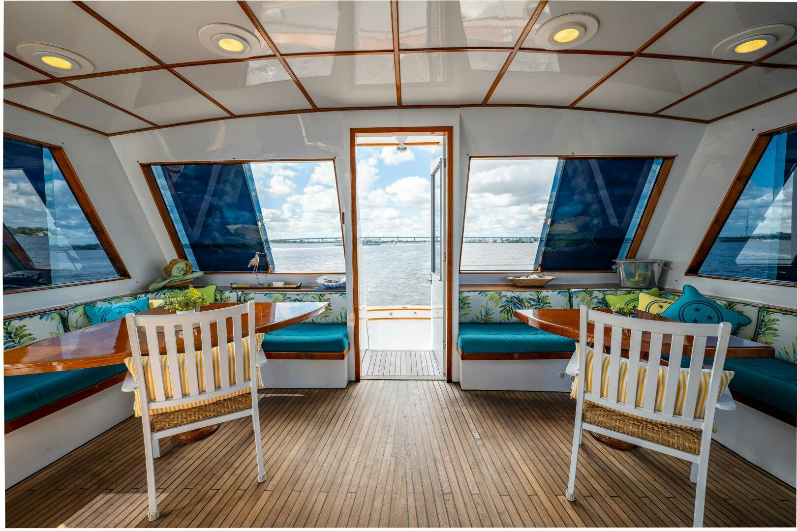 a room with a wood floor and a slide aboard TRILOGY Yacht for Sale