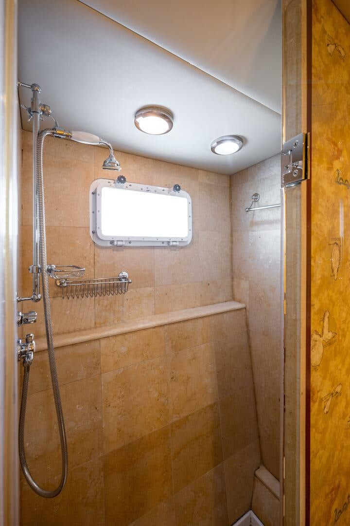 a shower with a glass door aboard TRILOGY Yacht for Sale