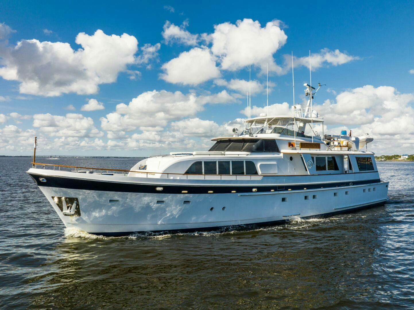 a white boat in the water aboard TRILOGY Yacht for Sale