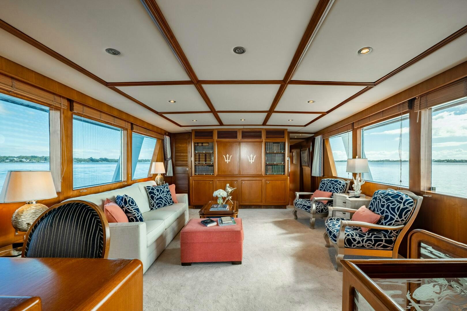 a living room with a couch and a table aboard TRILOGY Yacht for Sale