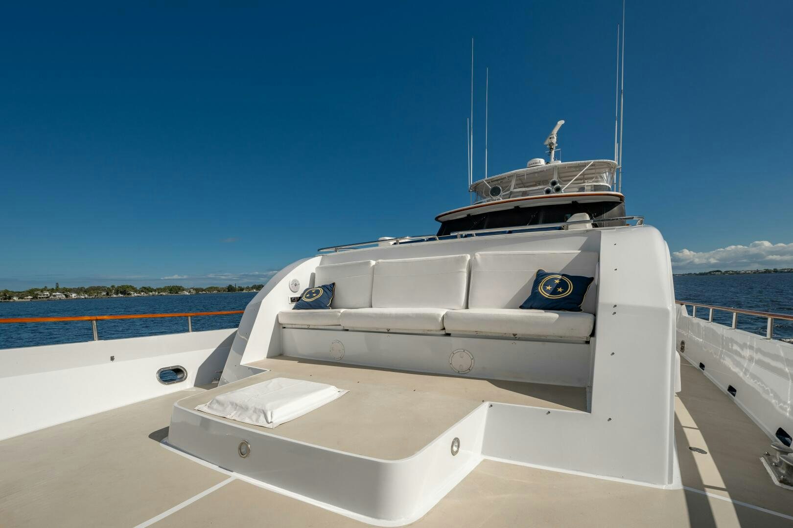 a white boat on a deck aboard TRILOGY Yacht for Sale