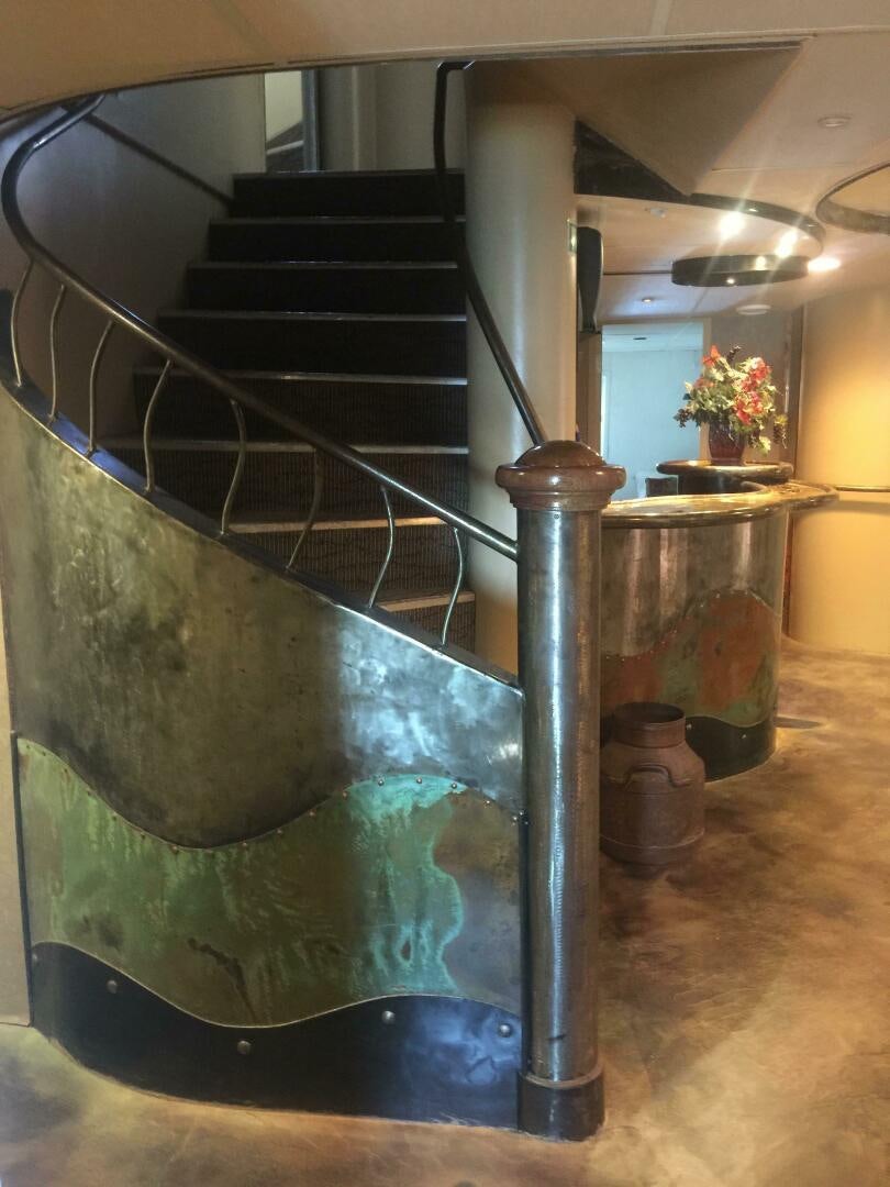 a large metal staircase aboard SALTY Yacht for Sale