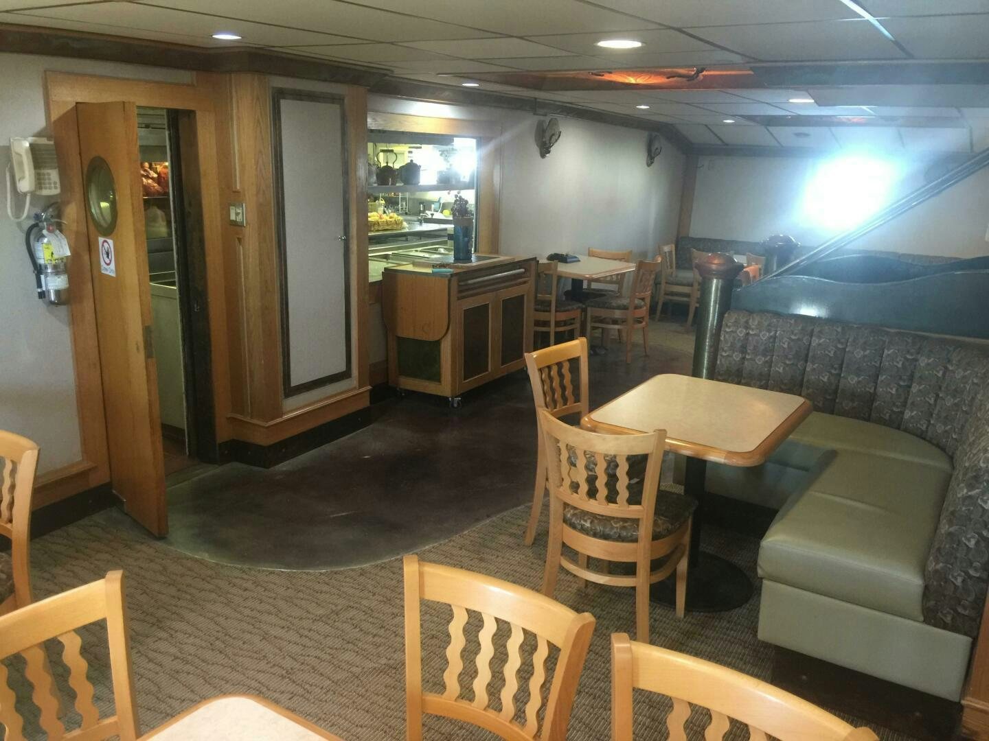 a room with a table and chairs aboard SALTY Yacht for Sale