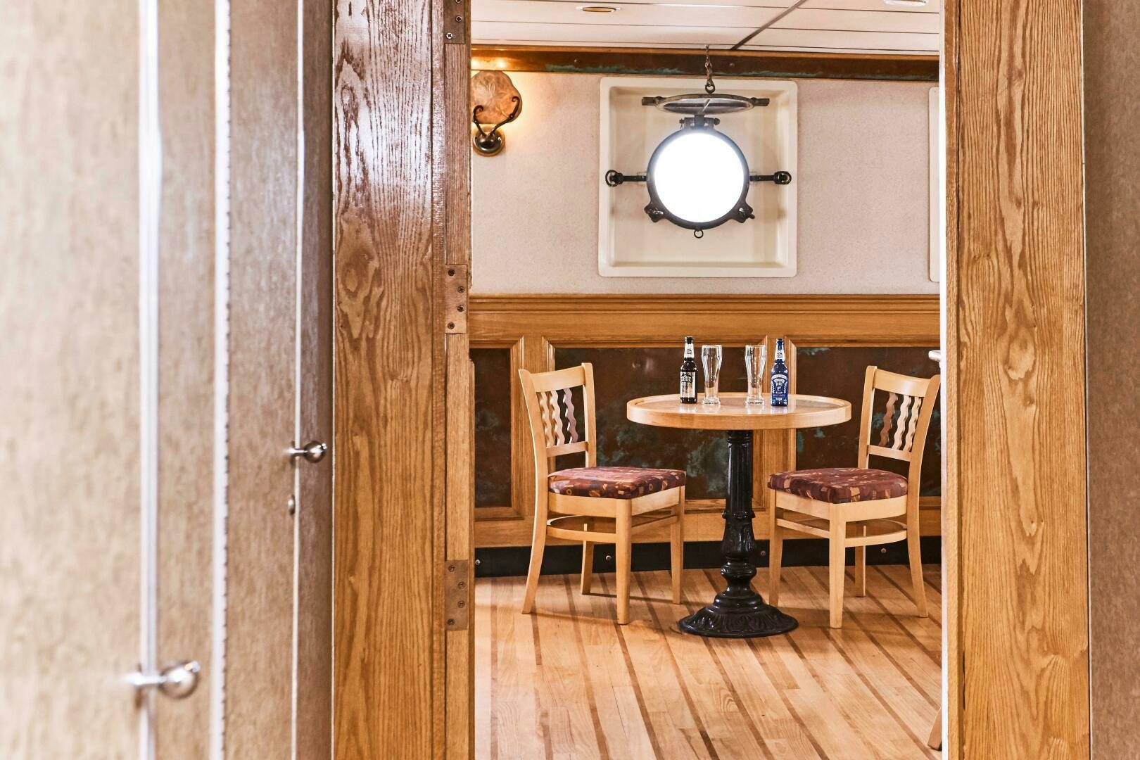 a table and chairs in a room aboard SALTY Yacht for Sale