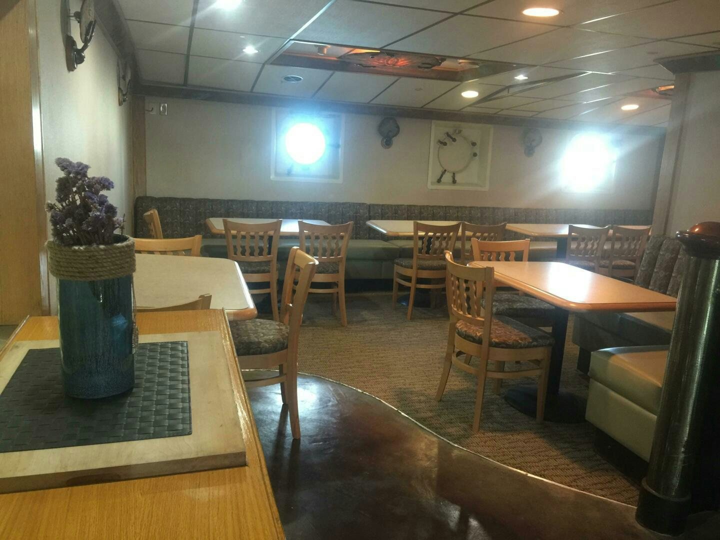 a room with tables and chairs aboard SALTY Yacht for Sale