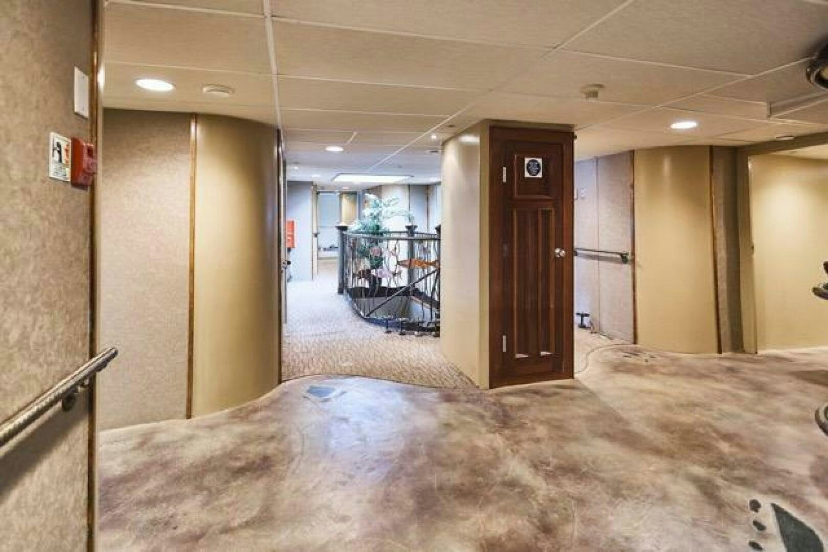 a large room with a bed and a table aboard SALTY Yacht for Sale