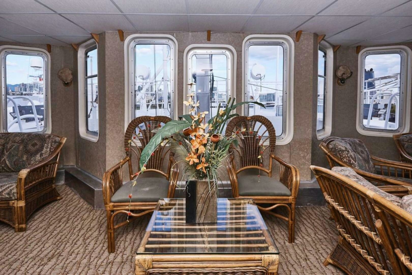 a living room with chairs and a table aboard SALTY Yacht for Sale