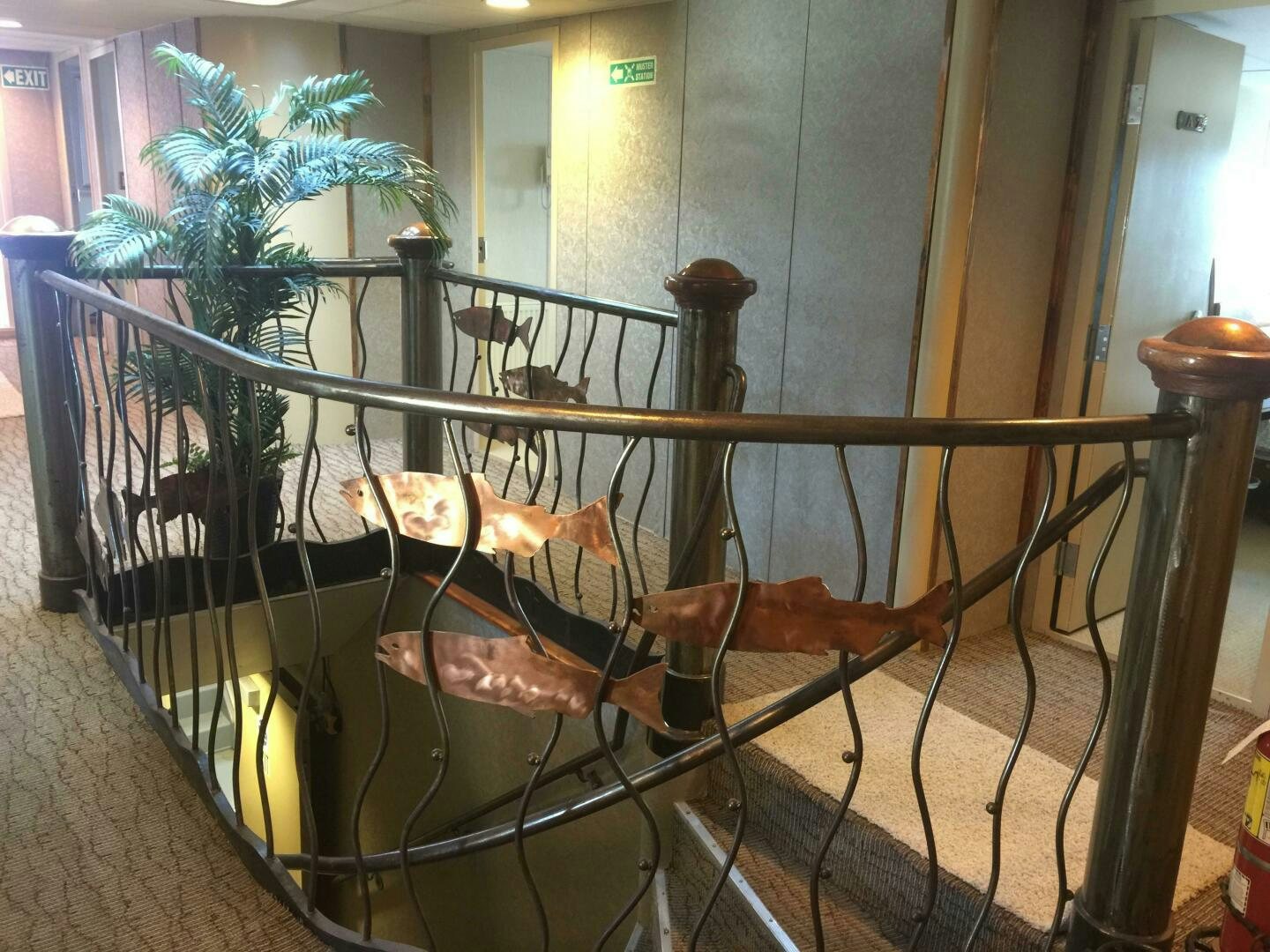 a large wooden chair with a railing aboard SALTY Yacht for Sale