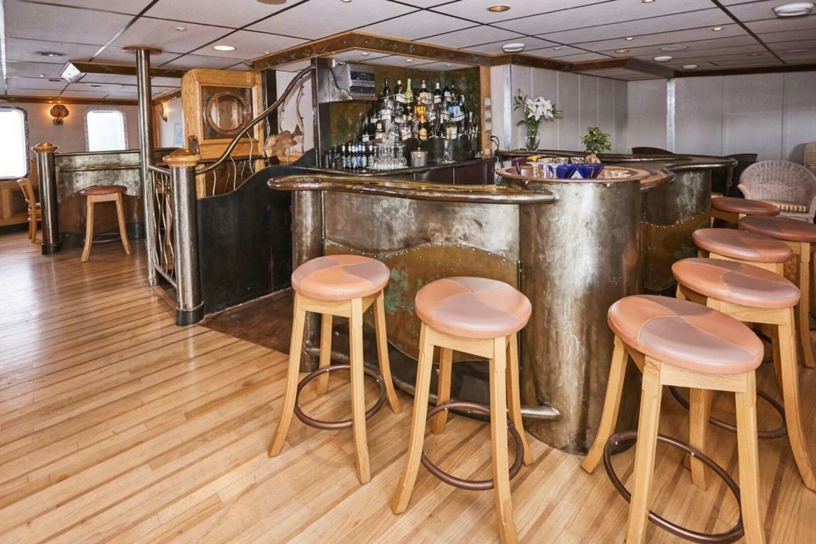 a bar with stools and stools aboard SALTY Yacht for Sale