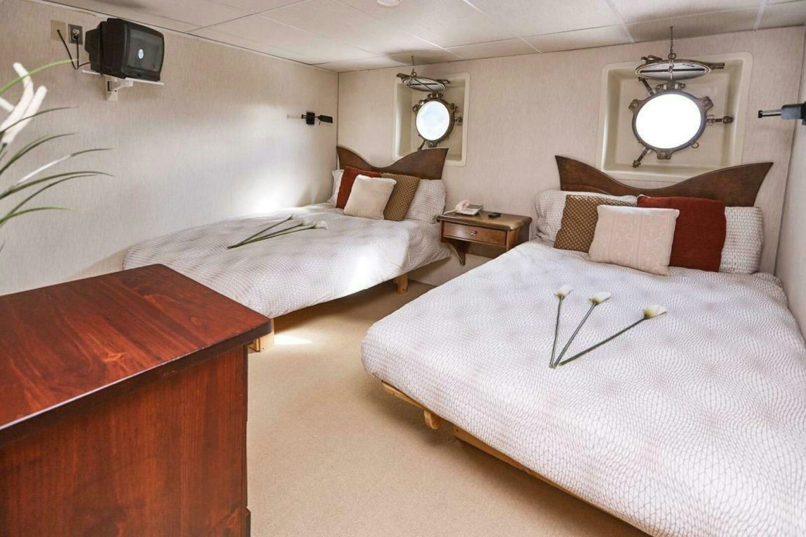 a room with two beds aboard SALTY Yacht for Sale