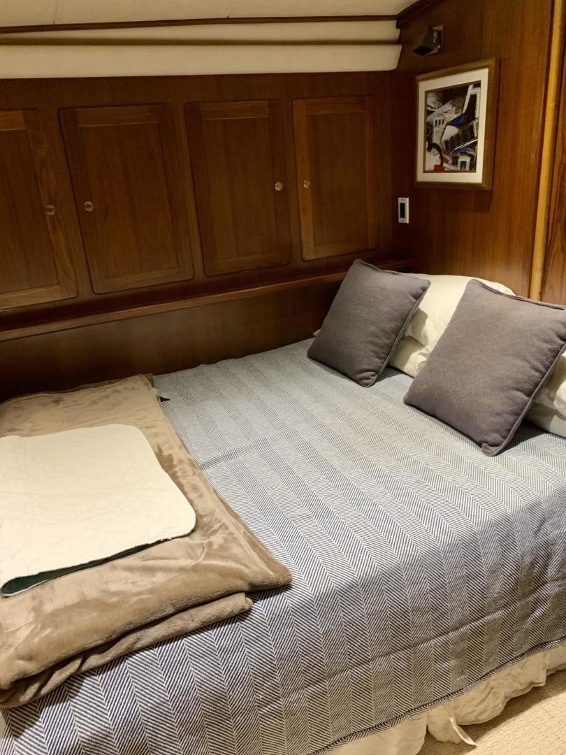 a bed with pillows aboard OBSESSION Yacht for Sale