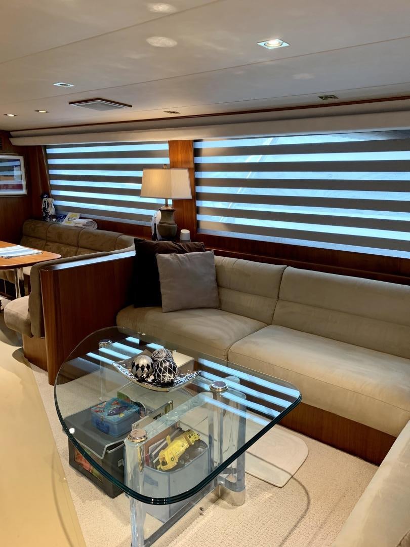 a living room with a coffee table aboard OBSESSION Yacht for Sale