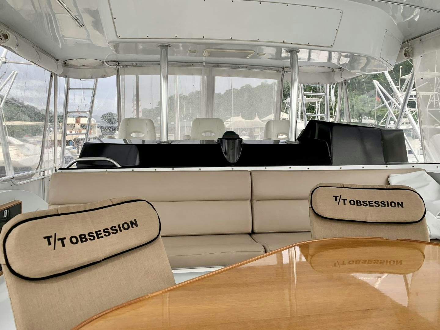 a boat with a seat aboard OBSESSION Yacht for Sale