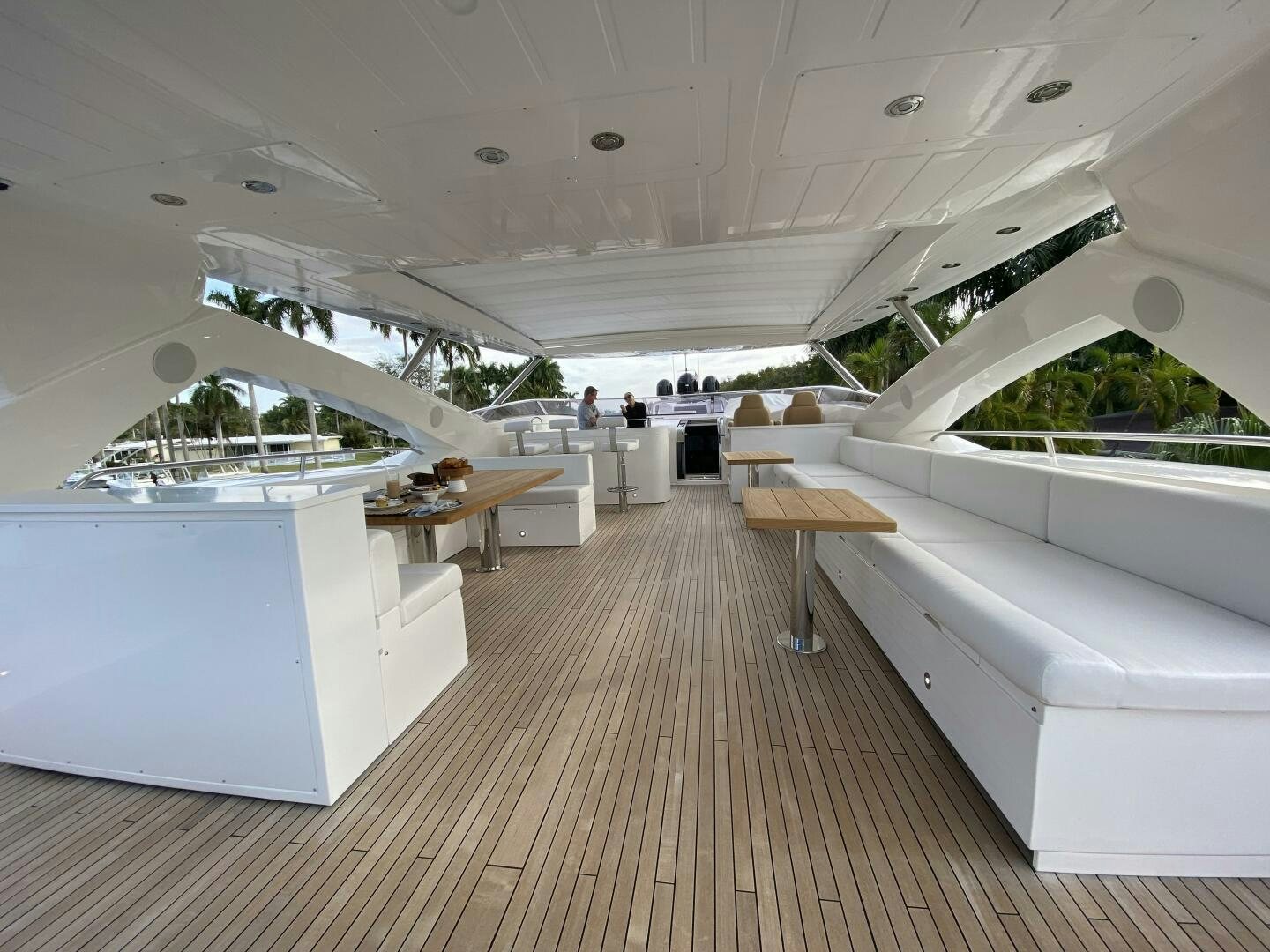 a large white room with tables and chairs aboard SEAHORSE Yacht for Sale