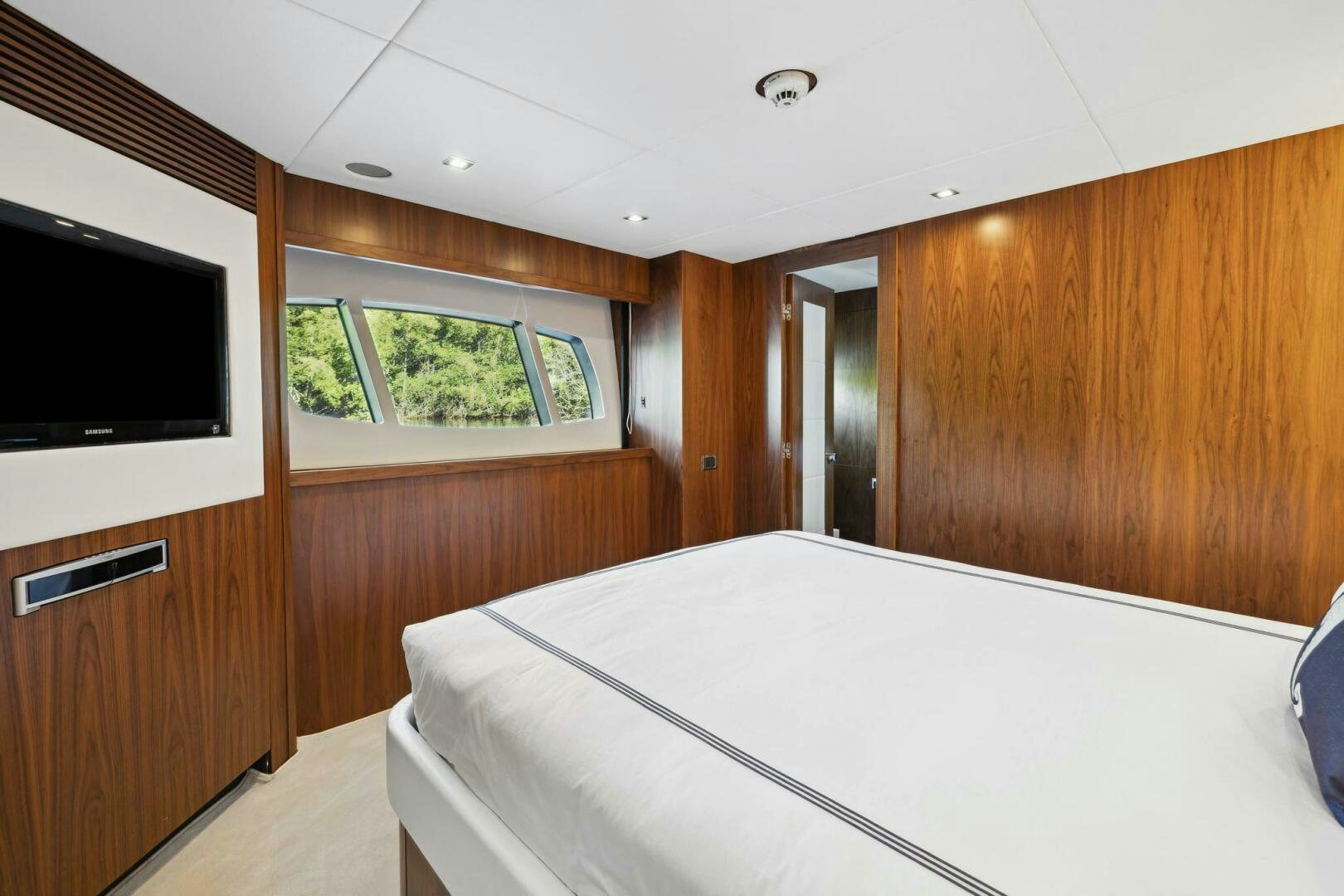 a bedroom with a bed and a television aboard SEAHORSE Yacht for Sale