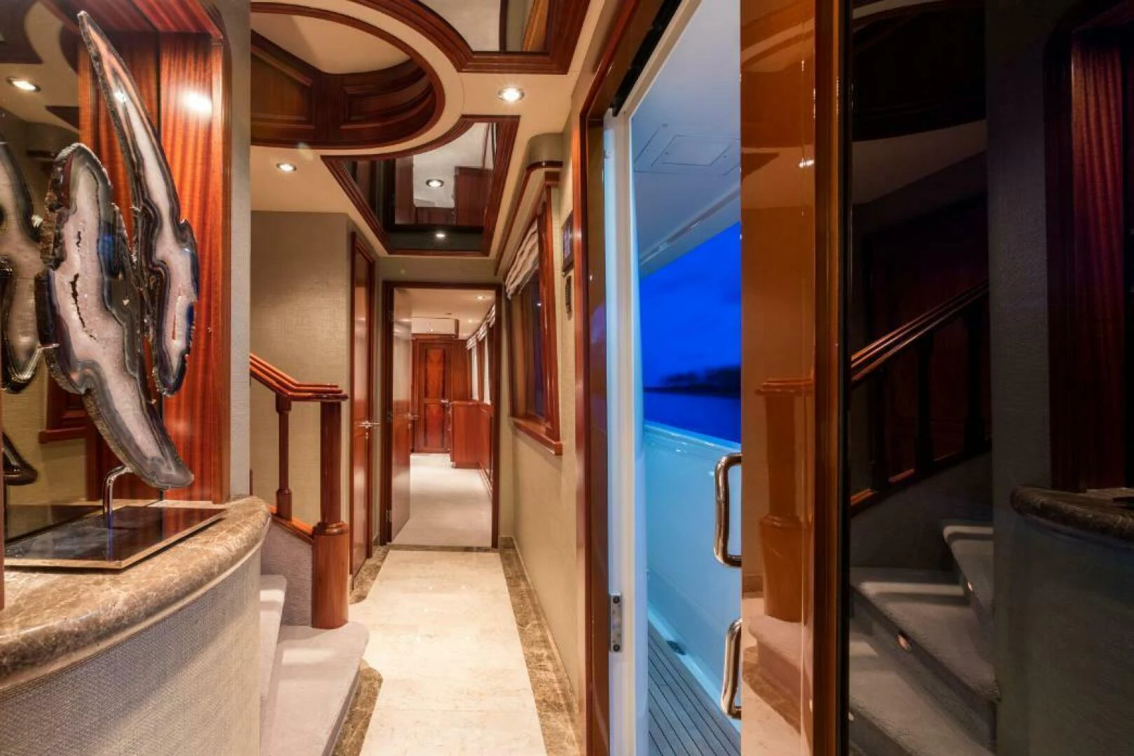 a hallway with statues aboard ALL INN Yacht for Sale