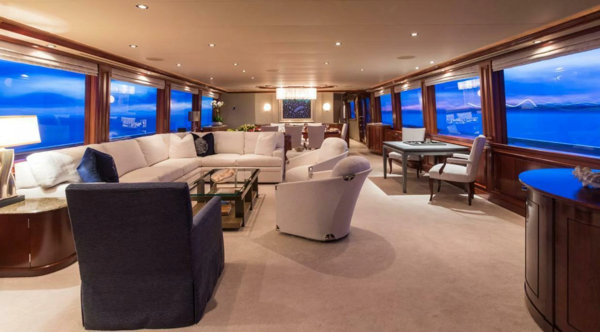 a living room with a large window aboard ALL INN Yacht for Sale