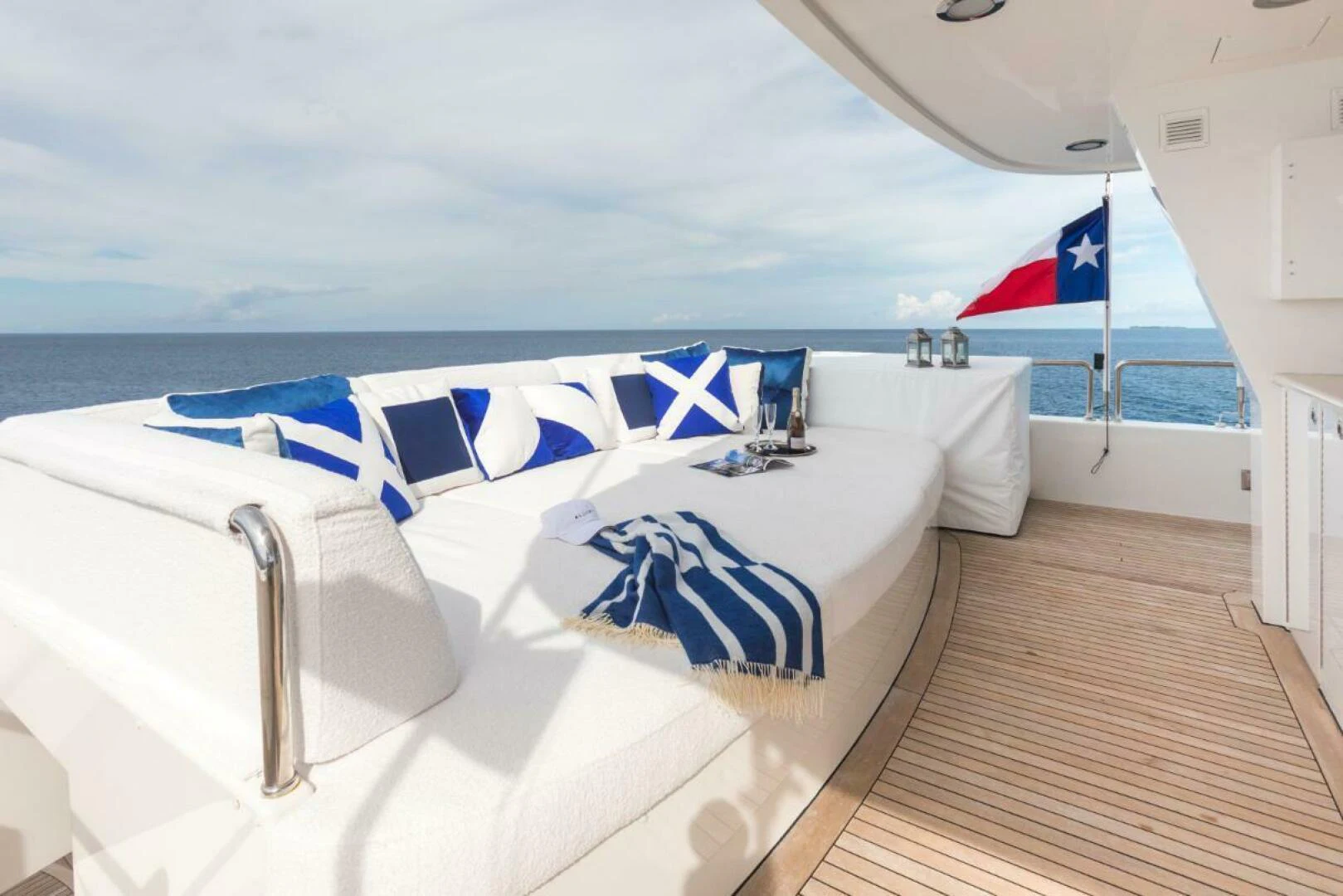 a large white bathtub with a flag on the side aboard ALL INN Yacht for Sale