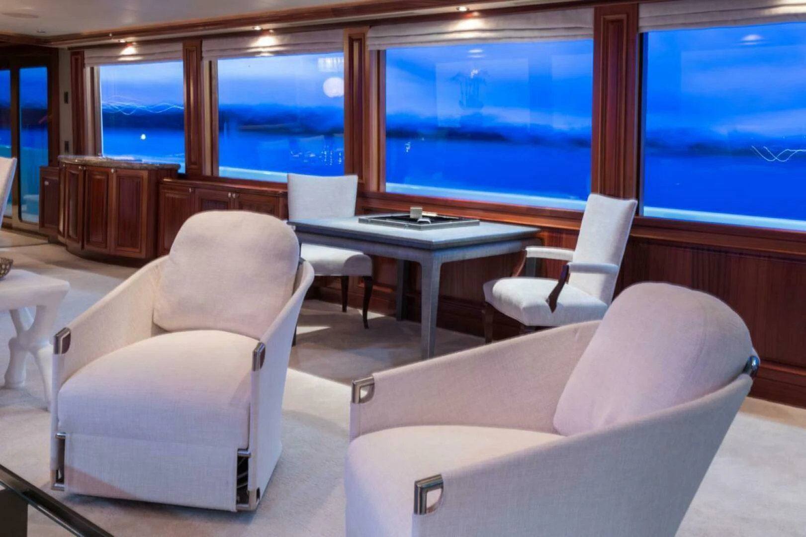 a room with a table chairs and a window aboard ALL INN Yacht for Sale