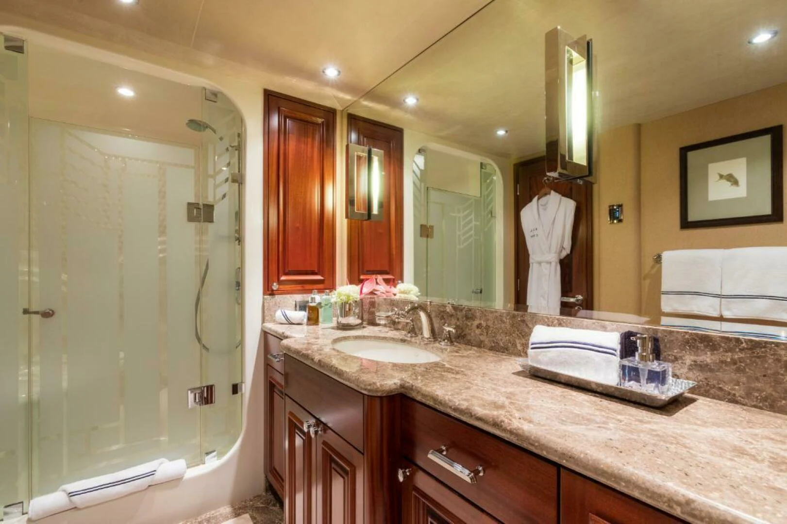a bathroom with a large mirror aboard ALL INN Yacht for Sale
