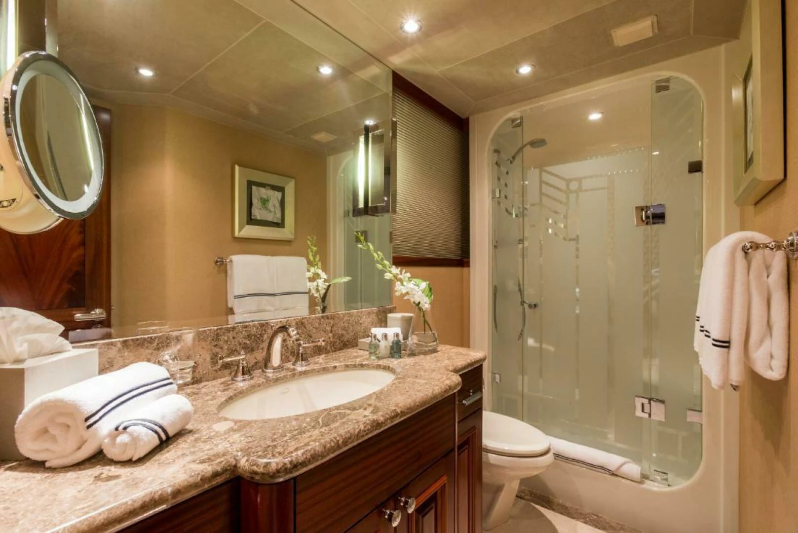 a bathroom with a large mirror aboard ALL INN Yacht for Sale