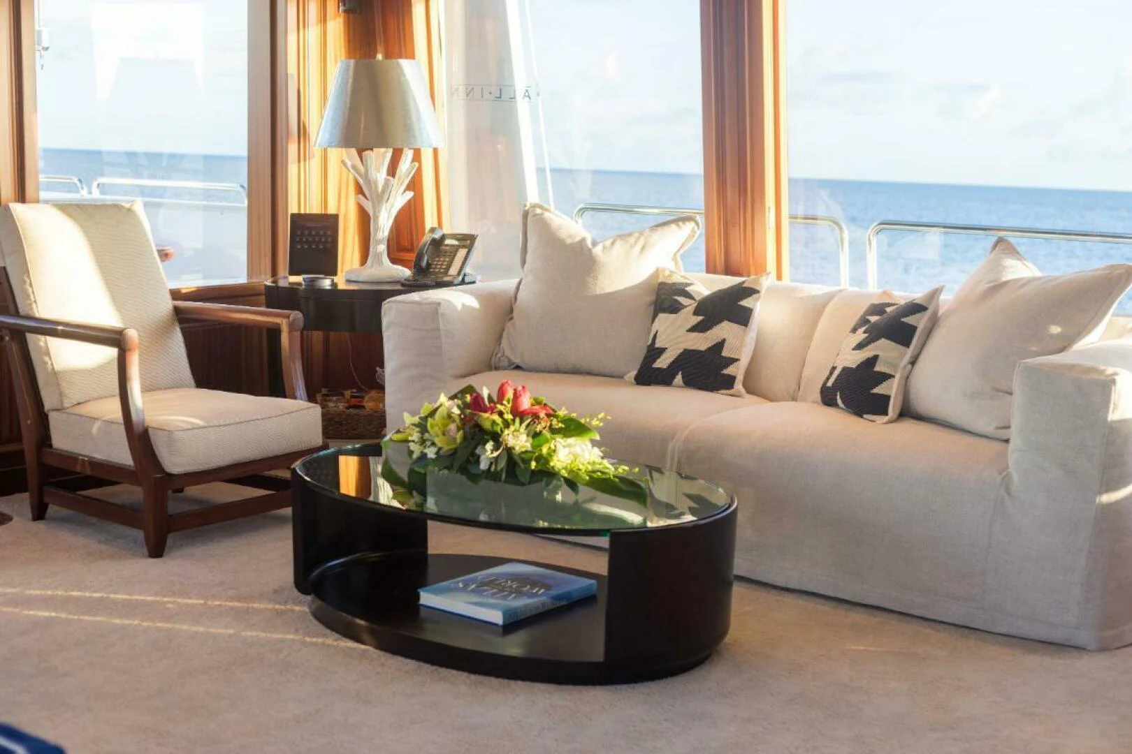 a living room with a couch and a coffee table aboard ALL INN Yacht for Sale