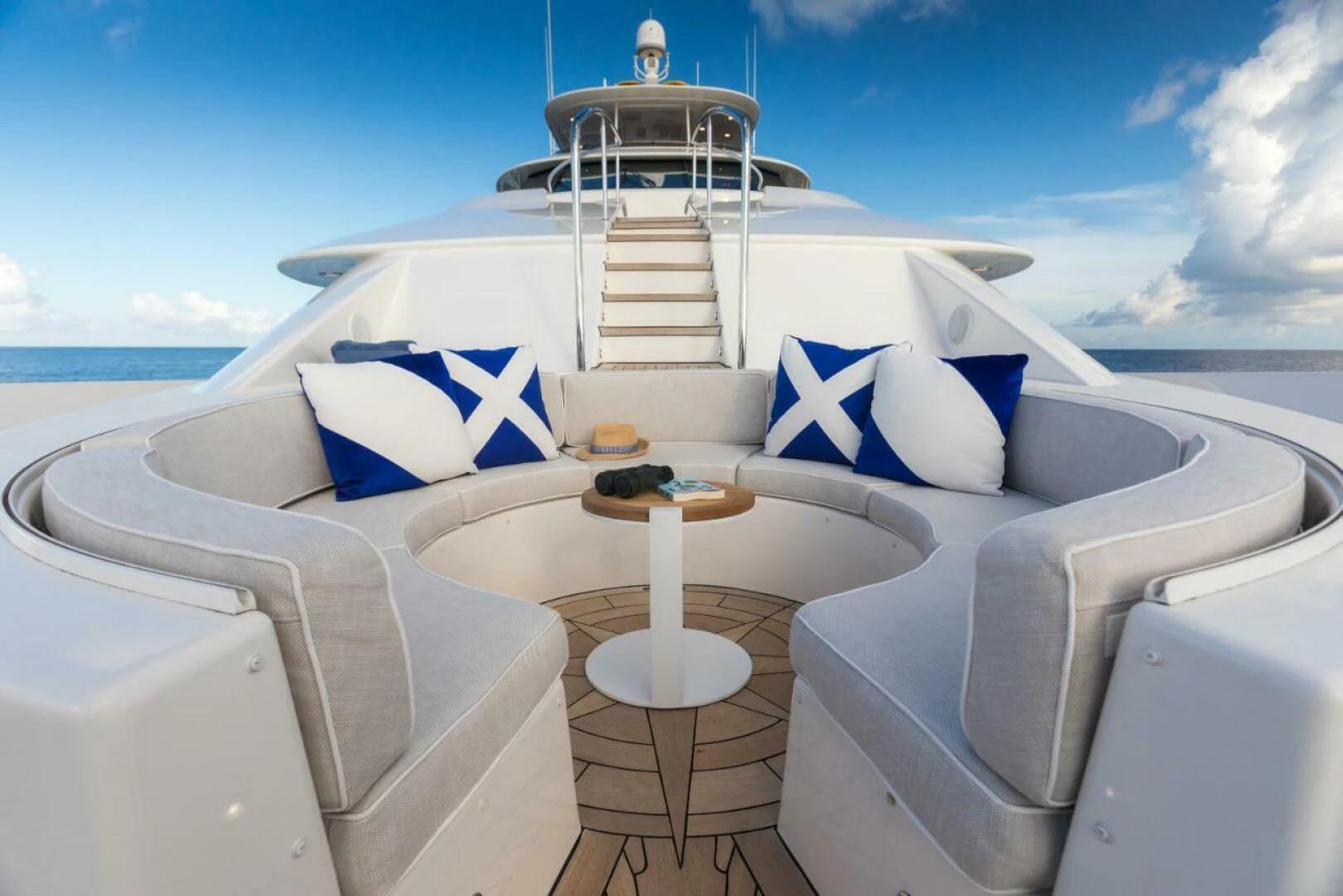 a boat with a flag on the front aboard ALL INN Yacht for Sale